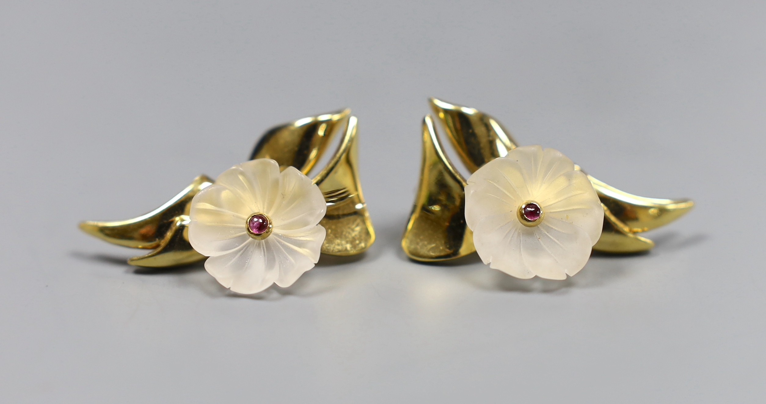 A pair of 18ct gold, rock crystal and cabochon ruby earrings of stylised floral design, 3cm, gross 10 grams